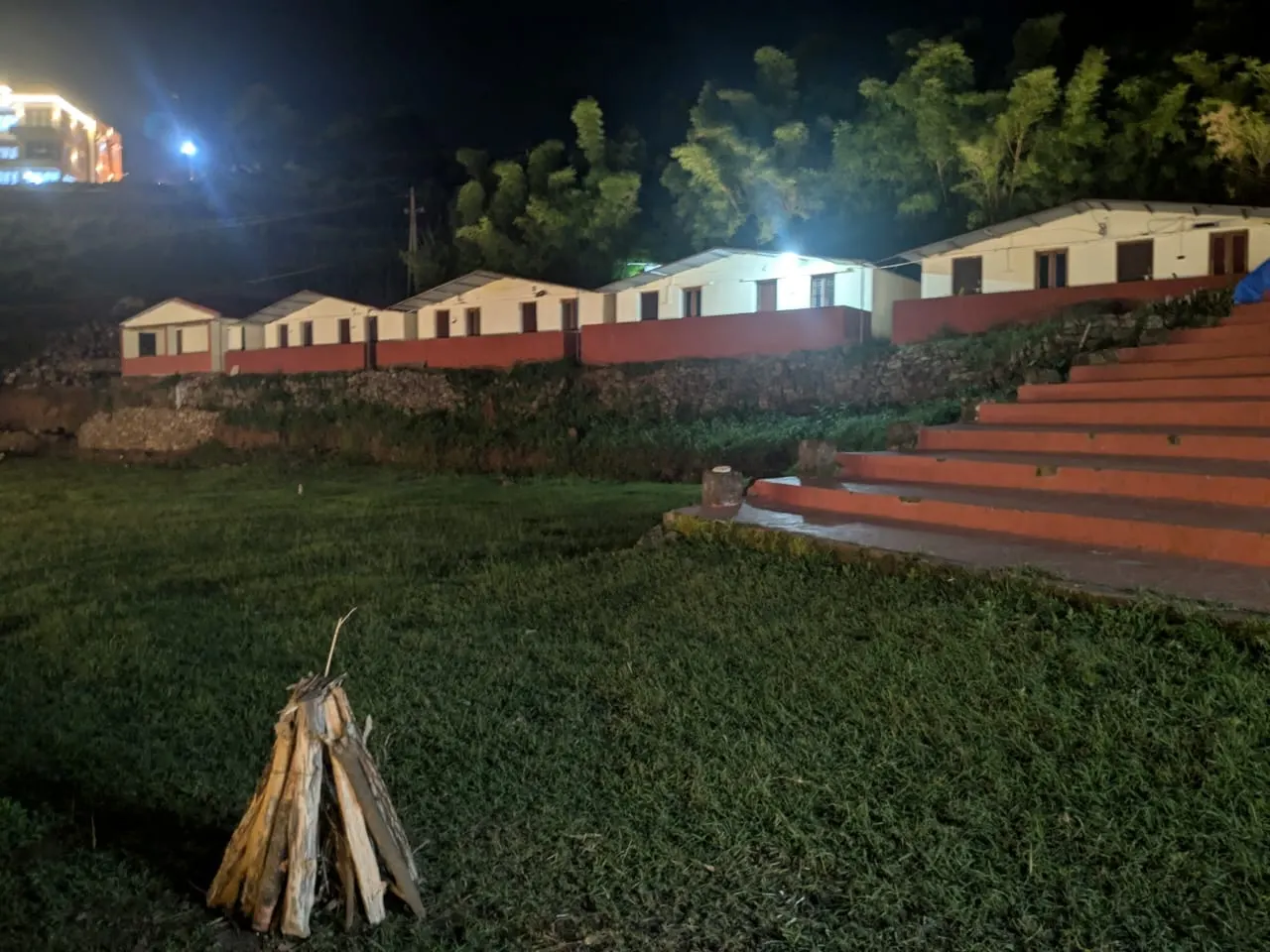 Campfire prepared on the resort lawn in the evening