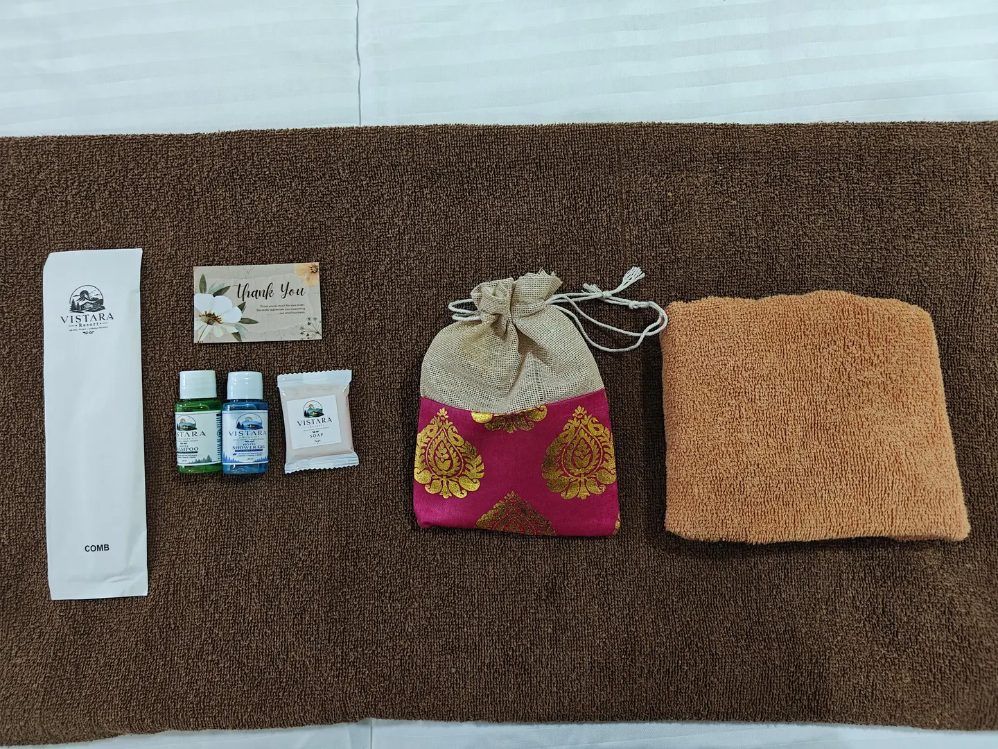 Vistara Resort welcome amenities arranged on the bed